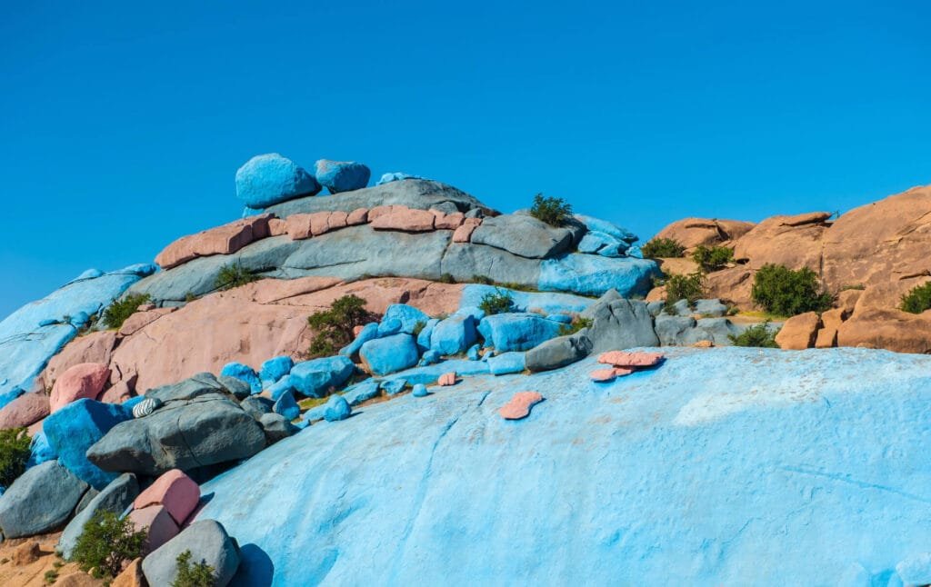 Scenic pink granite mountains and palm valley in Tafraoute, Morocco – perfect for travelers exploring the Anti-Atlas region